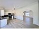 Contemporary eat-in kitchen with stainless appliances and view of the spacious living area at 6419 W Monte Cristo Ave, Glendale, AZ 85306
