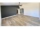 Open-concept living area with attractive flooring, ceiling fan, and modern wall colors at 6419 W Monte Cristo Ave, Glendale, AZ 85306