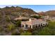 Expansive home with a pool nestled among mountains, offering both luxury and stunning natural beauty at 6512 N 31St Way, Phoenix, AZ 85016