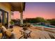Backyard with built in pool, a water feature, flowering bushes, and an outdoor seating area at 6512 N 31St Way, Phoenix, AZ 85016