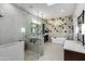 Elegant bathroom features a glass-enclosed shower, soaking tub and stylish vanity with dual sinks at 6512 N 31St Way, Phoenix, AZ 85016