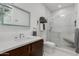 Modern bathroom featuring sleek vanity, glass shower, and white tile, creating a spa-like ambiance at 6512 N 31St Way, Phoenix, AZ 85016
