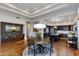 Dining area with stylish lighting, ample seating, and adjacent kitchen with premium appliances at 6512 N 31St Way, Phoenix, AZ 85016