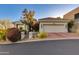 Charming single-story home featuring a 2-car garage, desert landscaping, and stone accents at 6512 N 31St Way, Phoenix, AZ 85016