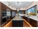 Modern kitchen features custom cabinetry, granite countertops, an island, and stainless appliances at 6512 N 31St Way, Phoenix, AZ 85016