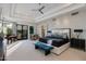 Bright main bedroom with neutral carpet, tray ceilings, an ensuite, and French doors to the backyard at 6512 N 31St Way, Phoenix, AZ 85016