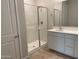 Bathroom features a glass-enclosed shower, white vanity, and bright lighting at 7216 E Blissful Breeze Ln, San Tan Valley, AZ 85143