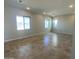 Bright living room with neutral walls, tile floors, recessed lighting, and large windows at 7216 E Blissful Breeze Ln, San Tan Valley, AZ 85143