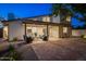 Inviting backyard with covered patio, and a brick-paved seating area at 7223 N 14Th St, Phoenix, AZ 85020