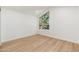 Bright bedroom featuring a window with natural light and wood-look flooring at 7223 N 14Th St, Phoenix, AZ 85020
