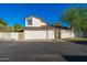 Charming two-story home with a white garage door, modern architecture, and well-maintained landscaping at 7223 N 14Th St, Phoenix, AZ 85020