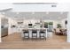 Well-equipped kitchen features white cabinetry, stainless appliances, and a large island with seating at 7223 N 14Th St, Phoenix, AZ 85020