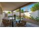 Covered outdoor patio with dining table and chairs, perfect for al fresco dining at 7223 N 14Th St, Phoenix, AZ 85020