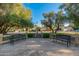 Scenic view of seating area surrounded by green trees with benches providing a relaxing outdoor experience at 7223 N 14Th St, Phoenix, AZ 85020
