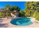 Inviting community pool area with clear blue water, lounge chairs, and shaded structures, perfect for enjoying sunny days at 7223 N 14Th St, Phoenix, AZ 85020