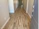 Inviting entryway featuring wood-look tile flooring and neutral-colored walls, leading into the home at 7259 E Blissful Breeze Ln, San Tan Valley, AZ 85143