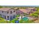 Beautiful backyard featuring a sparkling pool, lush turf, and comfortable seating at 7260 E Tasman St, Mesa, AZ 85207