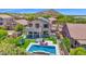 Stunning backyard featuring a sparkling pool, lush turf, and mountain views at 7260 E Tasman St, Mesa, AZ 85207