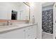 Modern bathroom featuring double sinks, white cabinetry, and a decorative mirror at 7260 E Tasman St, Mesa, AZ 85207
