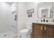 Charming bathroom with a glass walk-in shower, white fixtures, and a dark wood vanity at 7260 E Tasman St, Mesa, AZ 85207