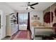 Comfortable bedroom with neutral tones, a cozy rug, and views of the outside at 7260 E Tasman St, Mesa, AZ 85207