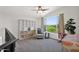 Bright bonus room with carpet features a cozy chair, built-in storage, and picturesque views at 7260 E Tasman St, Mesa, AZ 85207