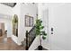 Inviting entryway features wood-look floors, staircase, and decorative accents at 7260 E Tasman St, Mesa, AZ 85207