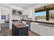 Well-lit kitchen features stainless appliances, granite countertops, and a convenient island at 7260 E Tasman St, Mesa, AZ 85207