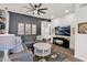 Spacious living room with a gray accent wall, comfortable sectional sofa, and modern decor at 7260 E Tasman St, Mesa, AZ 85207