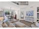Stylish living room with high ceilings, white walls, and an adjacent dining area at 7260 E Tasman St, Mesa, AZ 85207