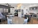 Open-concept living space with kitchen, dining area, and cozy living room, perfect for entertaining at 7260 E Tasman St, Mesa, AZ 85207