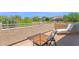 Private patio with desert views features durable stucco walls and an outdoor table set at 7260 E Tasman St, Mesa, AZ 85207