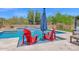 Beautiful swimming pool featuring in-pool seating and a waterfall feature for outdoor relaxation at 7260 E Tasman St, Mesa, AZ 85207