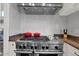 Modern stove with sleek stainless steel range hood and white subway tile backsplash at 7260 E Tasman St, Mesa, AZ 85207