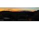Panoramic sunset view with mountains, offering a serene backdrop for the property and community at 7260 E Tasman St, Mesa, AZ 85207