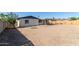 Expansive backyard with a dining set, and rock area for relaxing at 8339 W Devonshire Ave, Phoenix, AZ 85037