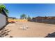 Large backyard with dining set under patio, and fenced perimeter at 8339 W Devonshire Ave, Phoenix, AZ 85037