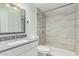 Bathroom featuring a tiled shower, modern sink, and new fixtures at 8339 W Devonshire Ave, Phoenix, AZ 85037