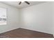 Bedroom features wood floors, window with blinds, and ceiling fan at 8339 W Devonshire Ave, Phoenix, AZ 85037