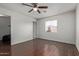 Inviting bedroom with hardwood floors, a ceiling fan, and a window at 8339 W Devonshire Ave, Phoenix, AZ 85037