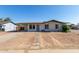 Charming single-story home with desert landscaping and covered carport at 8339 W Devonshire Ave, Phoenix, AZ 85037