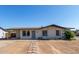 Charming single-story home with desert landscaping and covered carport at 8339 W Devonshire Ave, Phoenix, AZ 85037