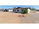 Charming single-story home with desert landscaping and flowering bush at 8339 W Devonshire Ave, Phoenix, AZ 85037