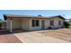 Charming single-story home with desert landscaping and covered carport at 8339 W Devonshire Ave, Phoenix, AZ 85037