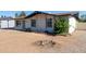 Charming single-story home with desert landscaping and flowering bush at 8339 W Devonshire Ave, Phoenix, AZ 85037
