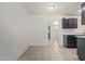 Bright eat-in kitchen with dark cabinets and tile floors at 8339 W Devonshire Ave, Phoenix, AZ 85037