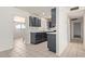 A charming kitchen featuring gray cabinets and tile flooring at 8339 W Devonshire Ave, Phoenix, AZ 85037