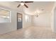 Bright living room with tile flooring, ceiling fan, and natural light at 8339 W Devonshire Ave, Phoenix, AZ 85037