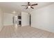 Bright living room with tile flooring and access to kitchen at 8339 W Devonshire Ave, Phoenix, AZ 85037