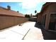 Wide backyard featuring desert landscaping, a brick patio, and a block wall at 9285 E Sutton Dr, Scottsdale, AZ 85260